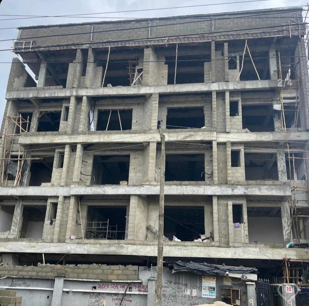 A multi-storey building takes shape, floor by floor.