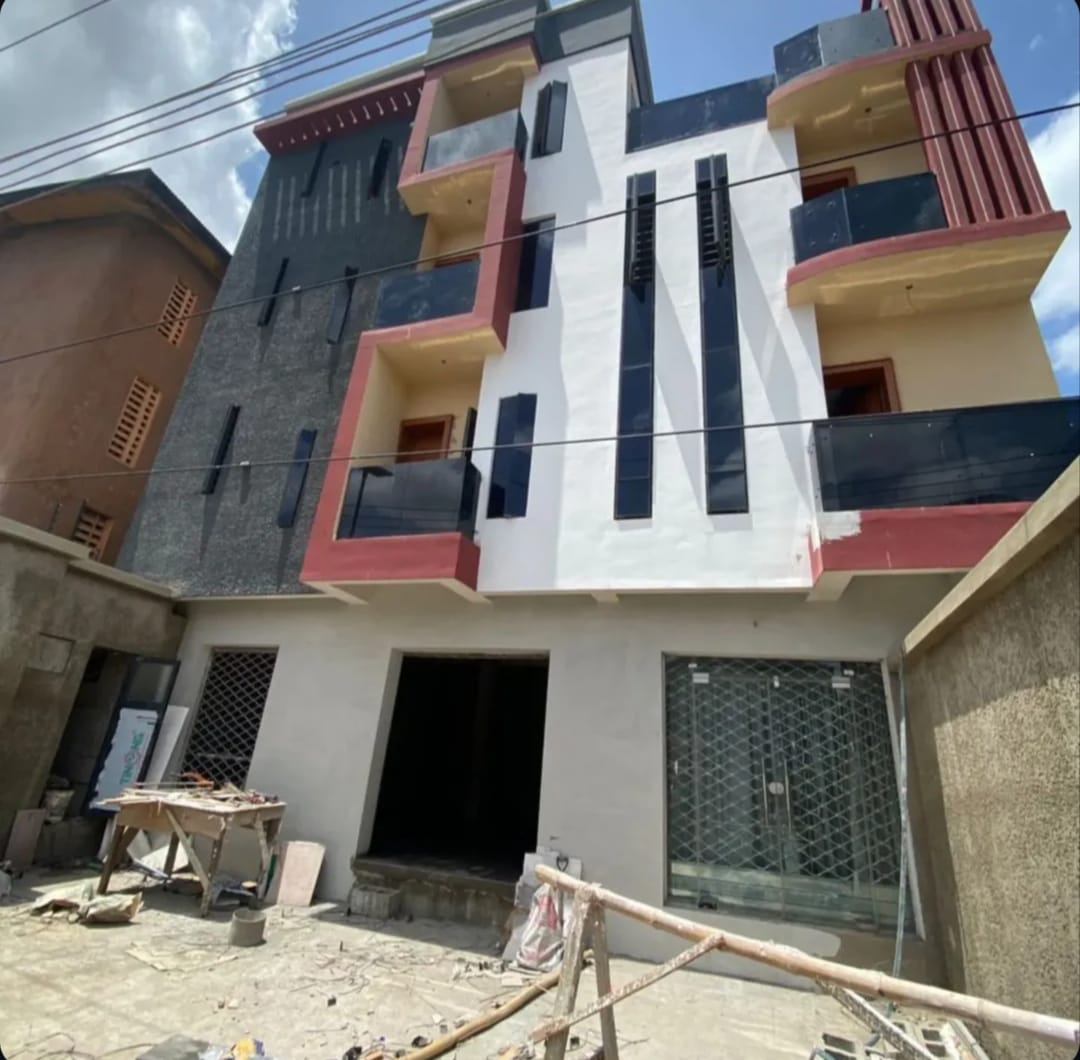 A finished building with ground-floor retail frontage