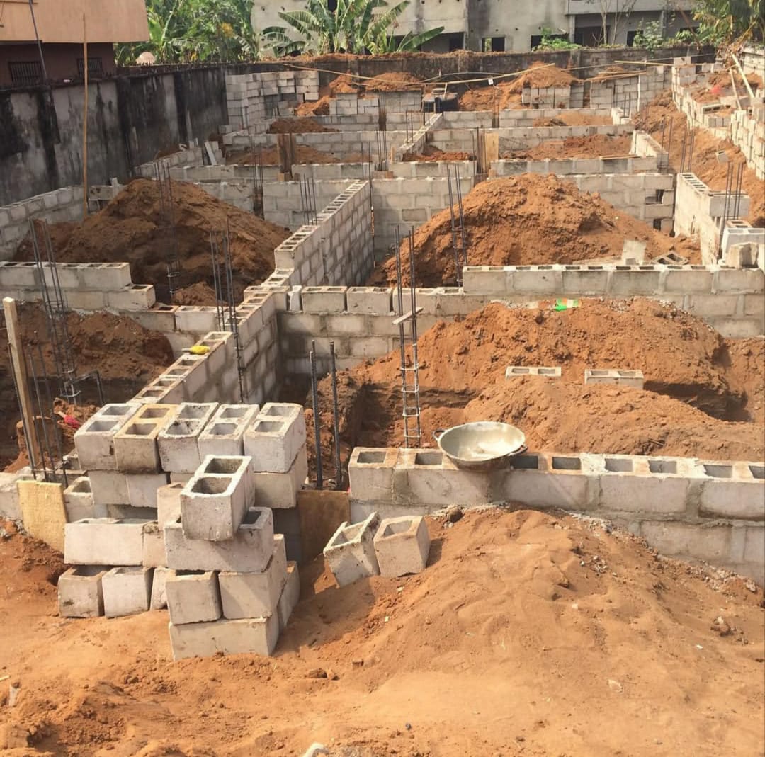 Foundation walls laid out across a multi-unit development.