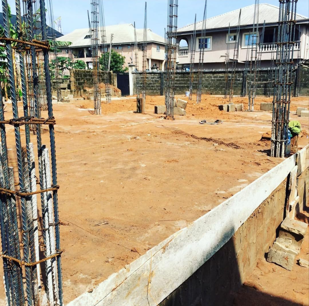 Column starter bars set out before block work begins.